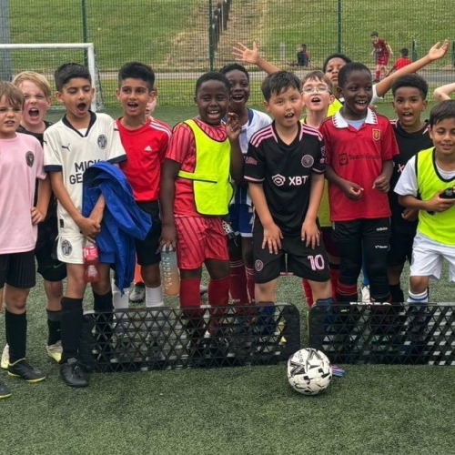Children playing football.